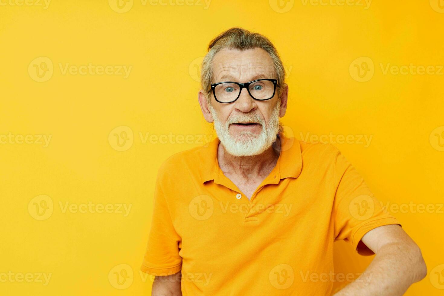 Photo of retired old man with a gray beard in glasses isolated background