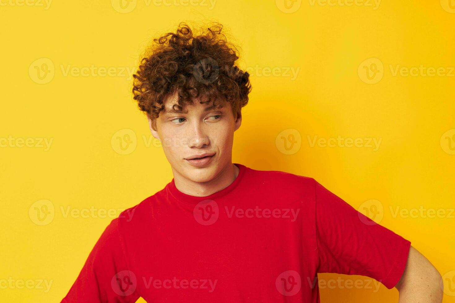 cute red-haired guy red t shirt fun posing casual wear isolated background unaltered photo