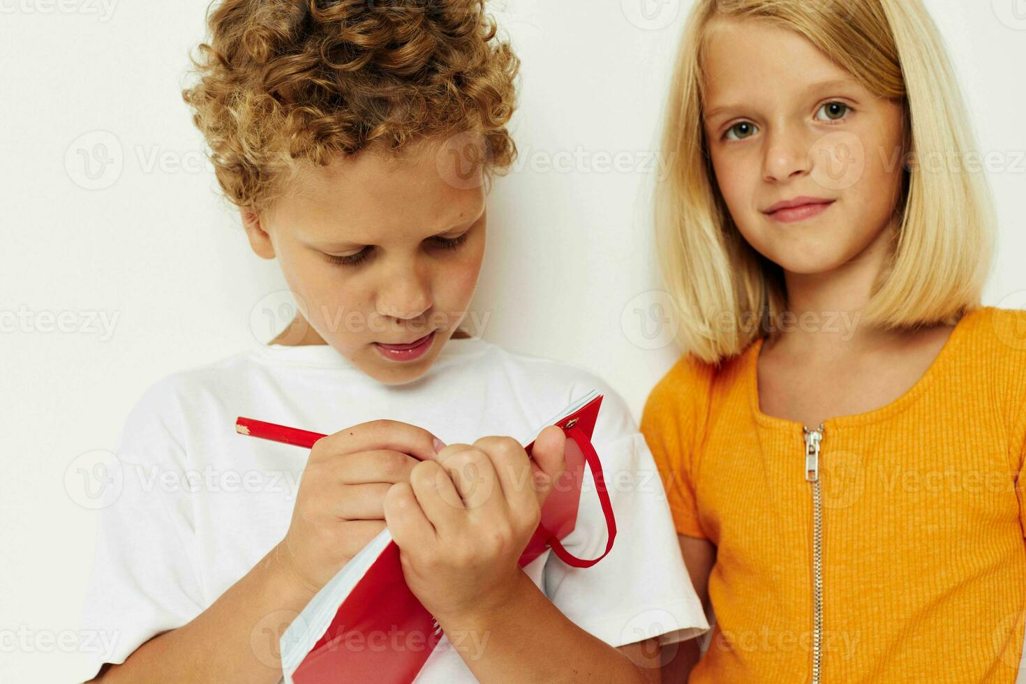 Cute preschool kids stand next to notepad pencil drawing emotions color background unaltered photo