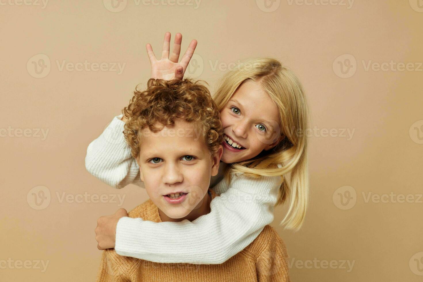 Photo of two children standing next to posing emotions isolated background