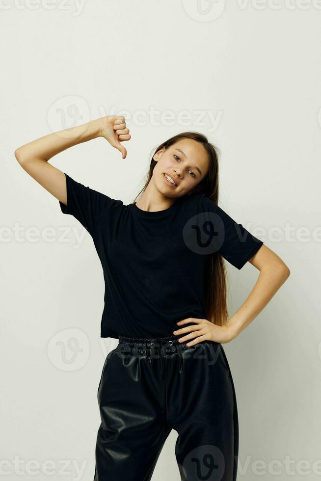 beautiful girl in a black t-shirt hand gesture fun fitness training photo