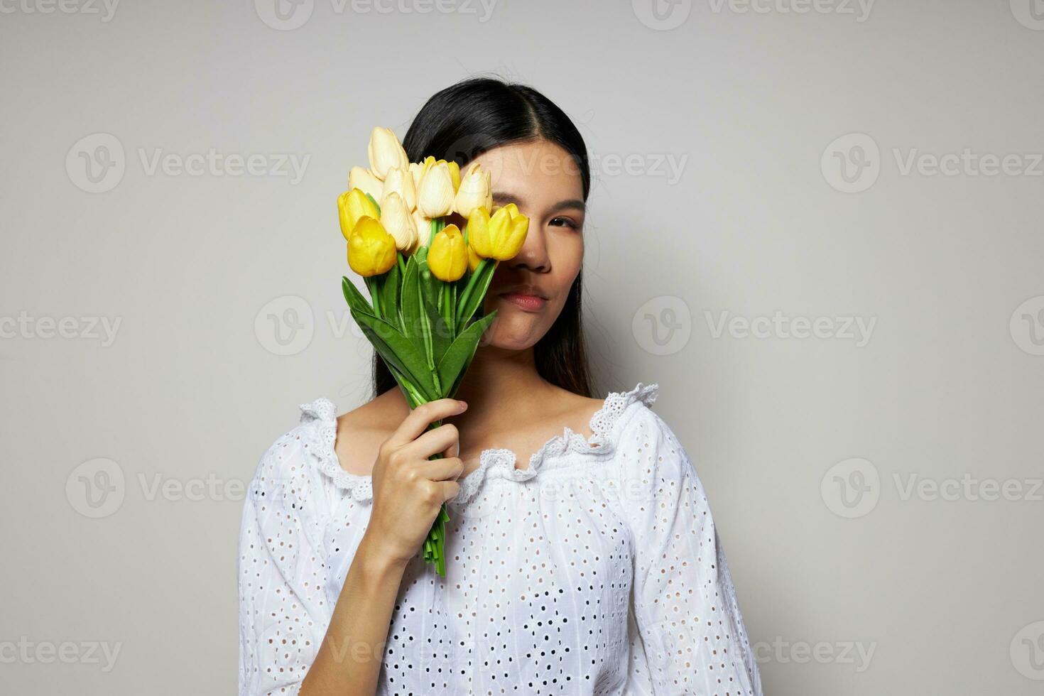 Young Asian woman with flowers photo