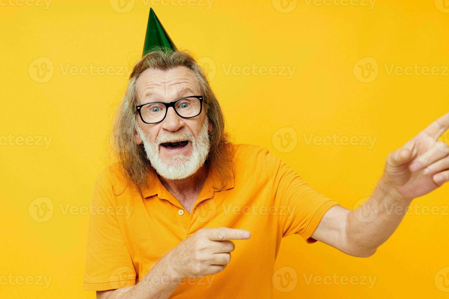 Portrait of happy senior man fun birthday cap on the head monochrome shot photo