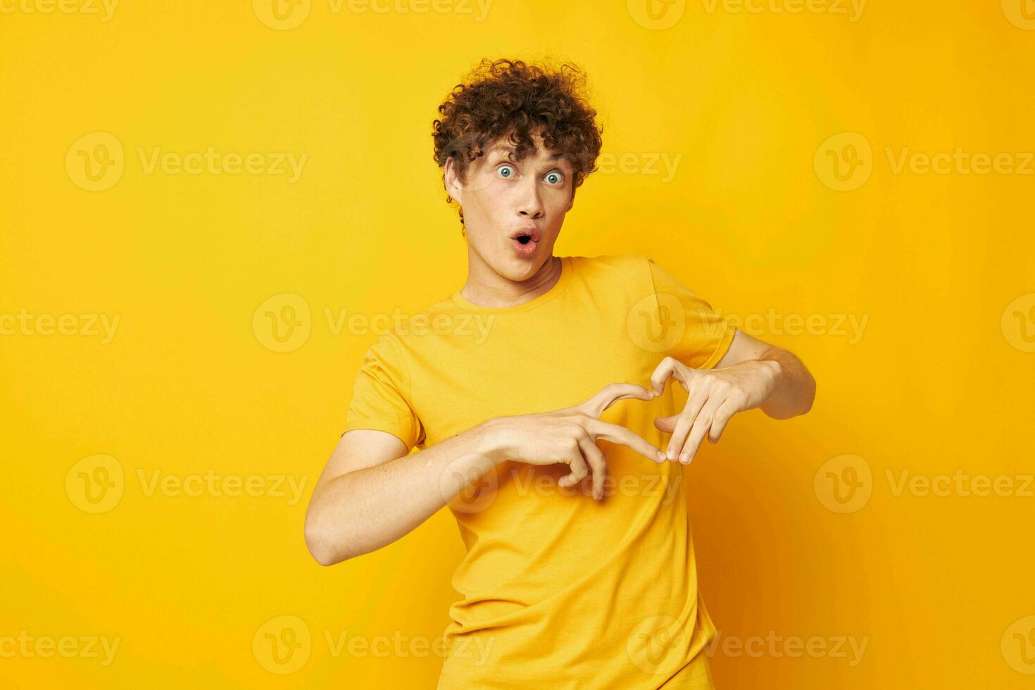 portrait of a young curly man Youth style studio casual wear isolated background unaltered photo