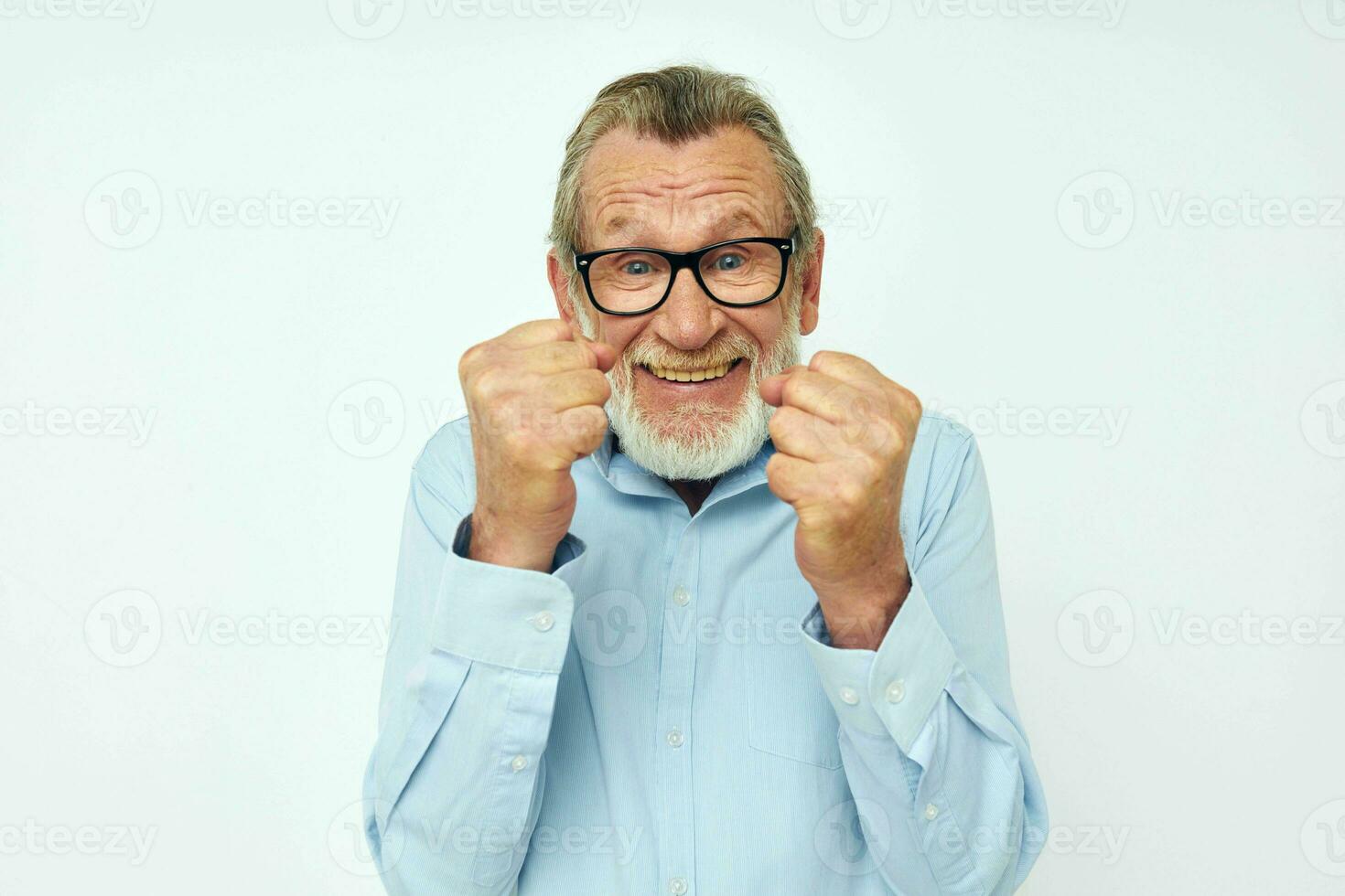 Portrait of happy senior man in shirt and glasses posing emotions cropped view photo