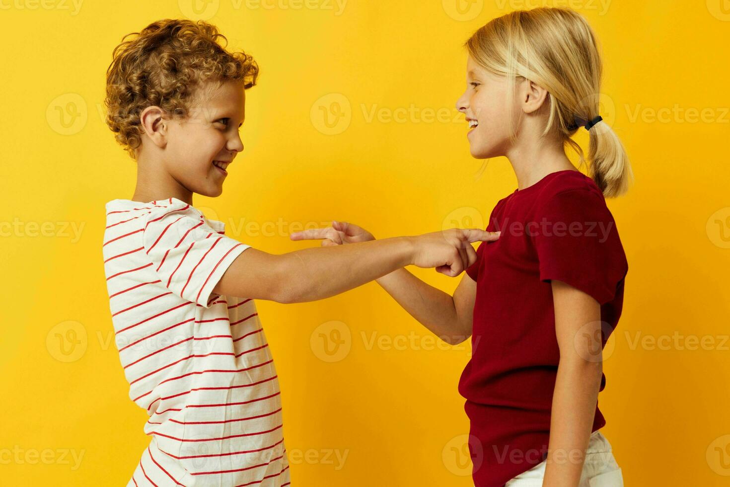 Cute preschool kids cuddling fashion childhood entertainment on colored background photo