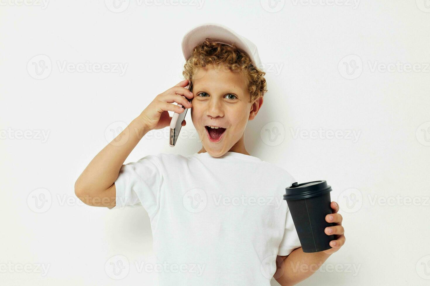 cute boy what kind of drink is the phone in hand communication light background unaltered photo