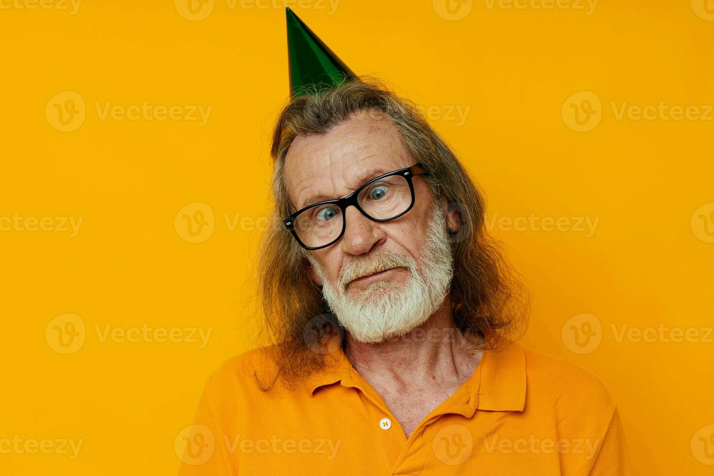 old man wearing glasses green cap on his head holiday emotions isolated background photo