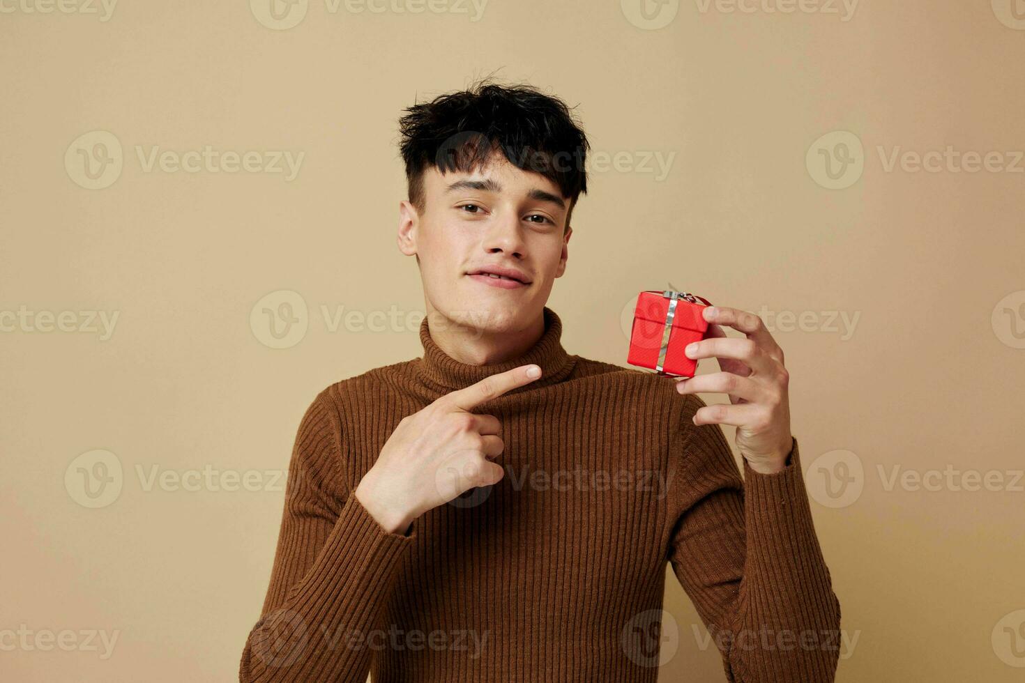 Photo young boyfriend stylish hairstyle brown turtleneck gift box Lifestyle unaltered