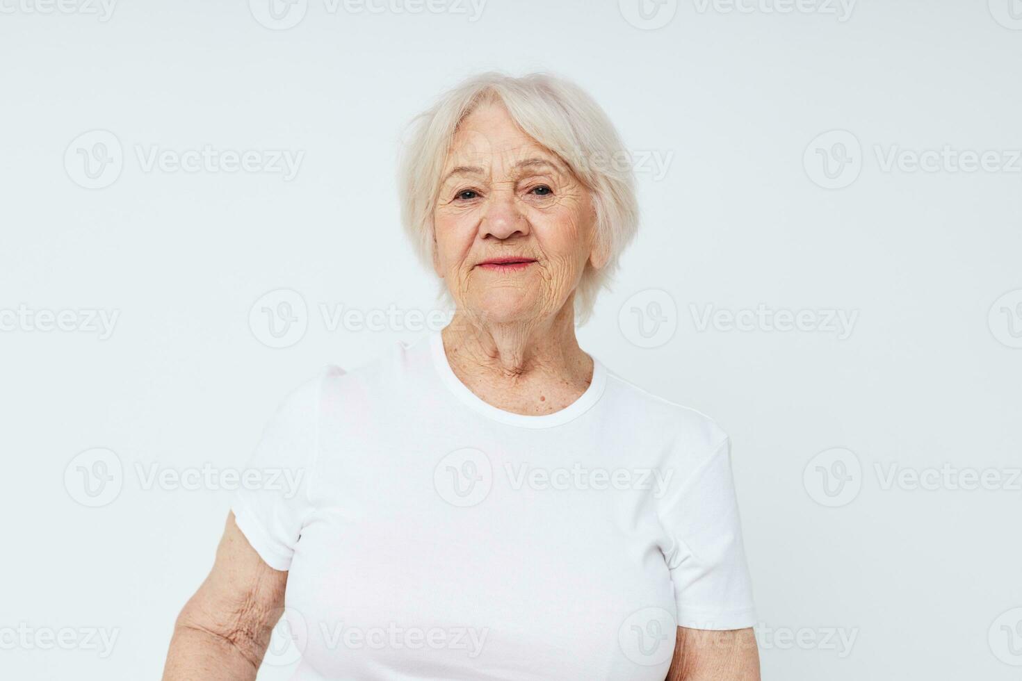 close-up of a cheerful elderly woman in a white t-shirt photo