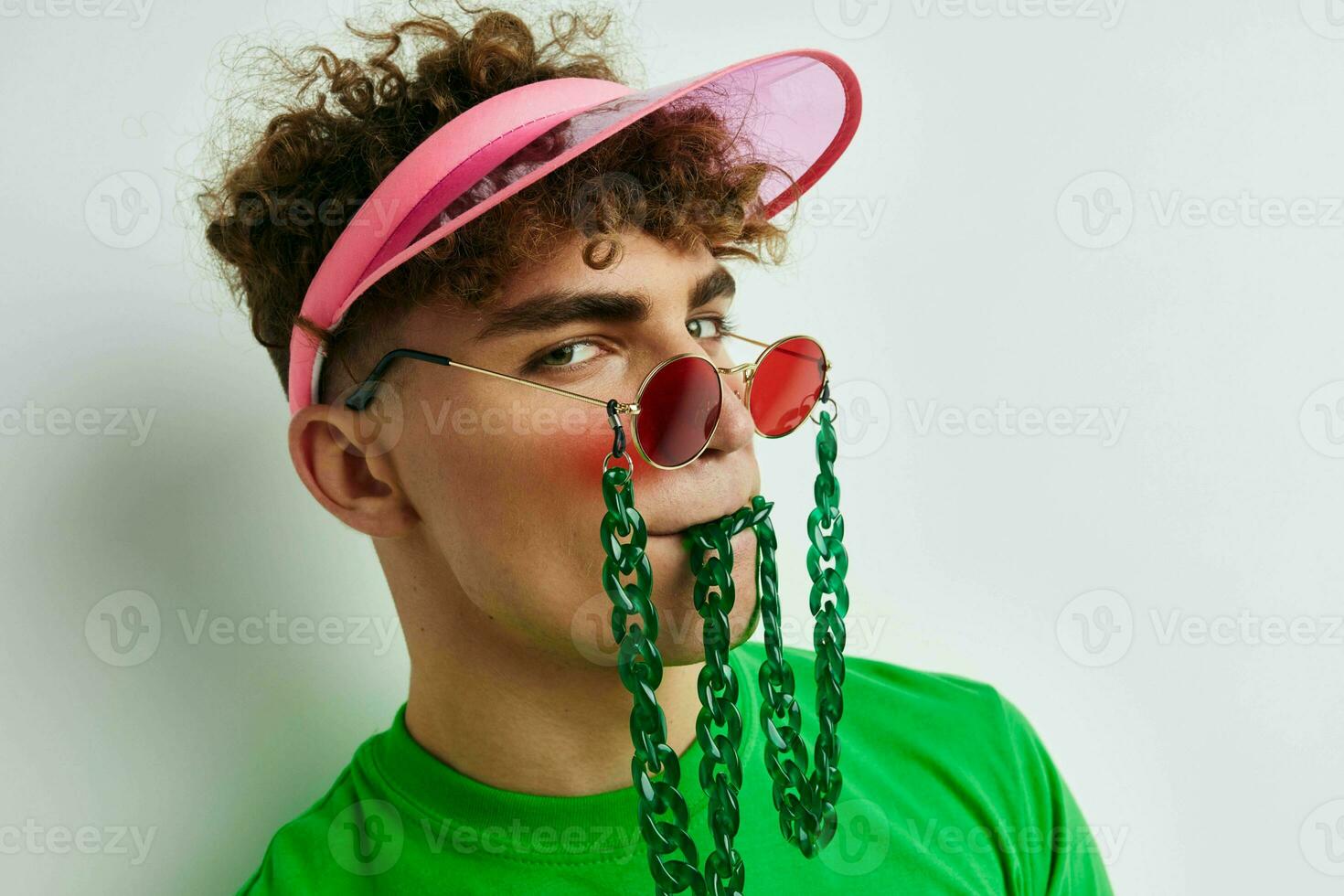 handsome young man stylish glasses cap close-up isolated background photo