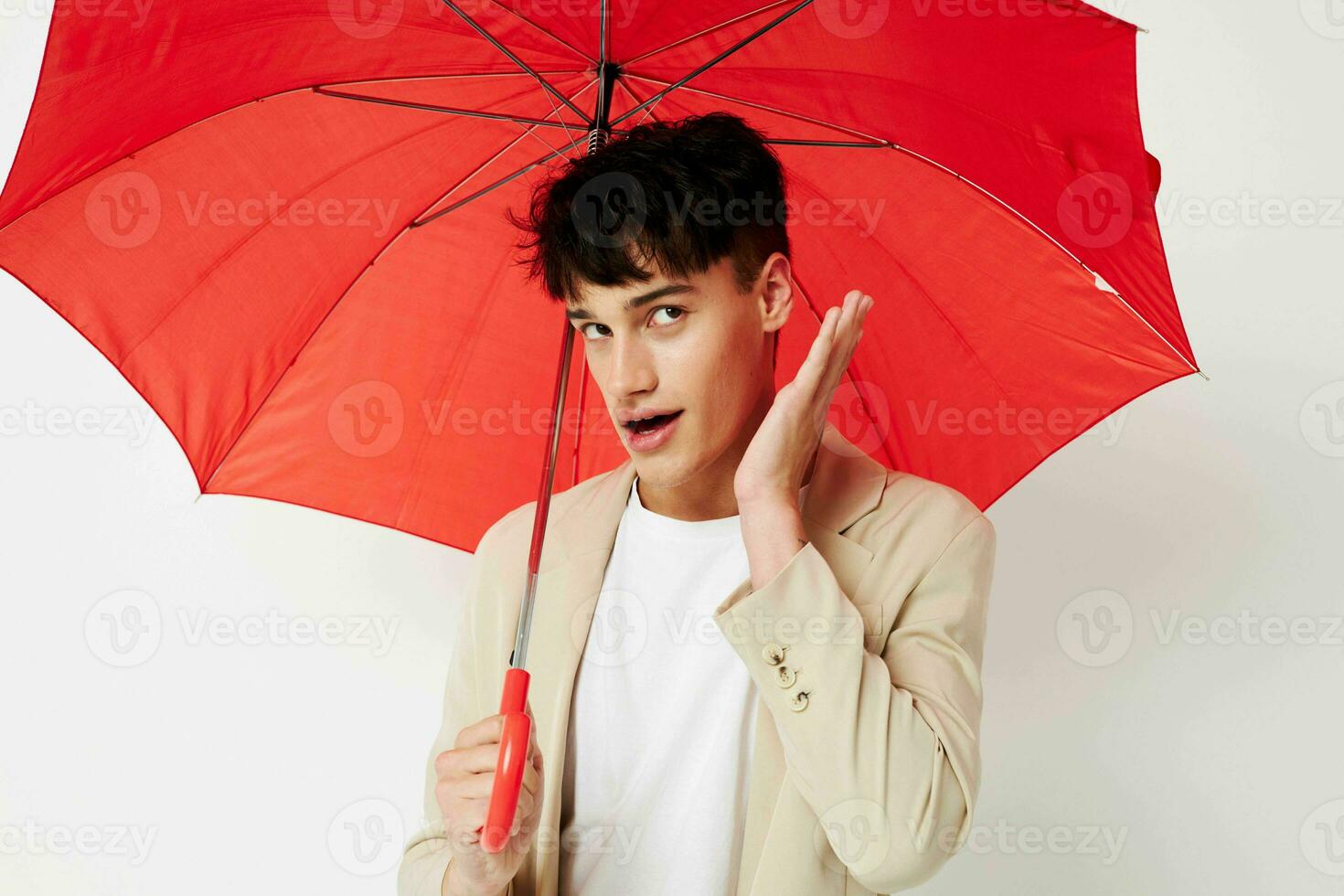 A young man rain protection in hand in hand modern style isolated background unaltered photo