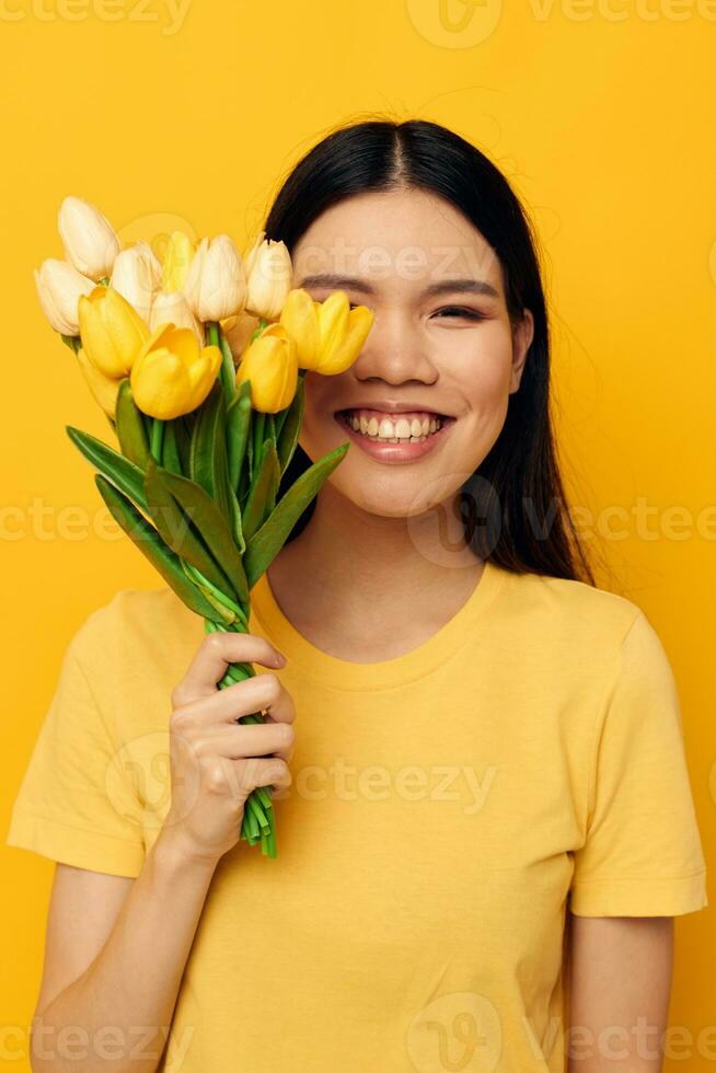 pretty brunette bouquet of flowers in hands spring fun posing studio model unaltered photo