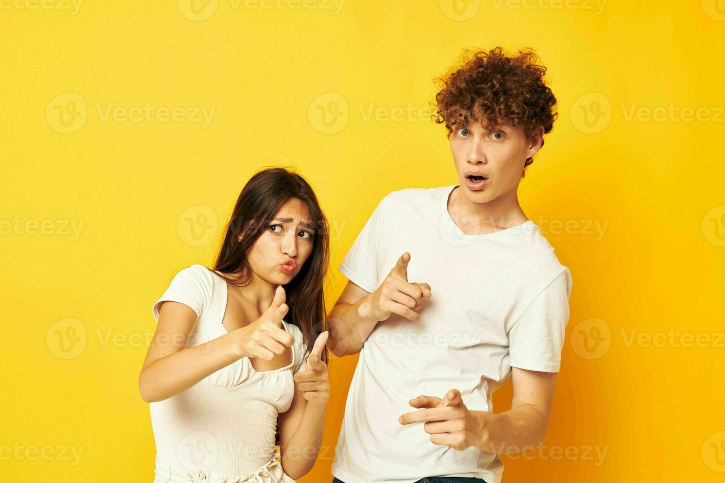 teenagers standing side by side in white t-shirts posing Lifestyle unaltered photo