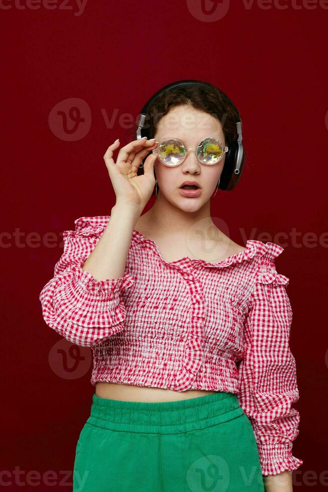 woman with headphones listening to music glasses and diamond fashion photo