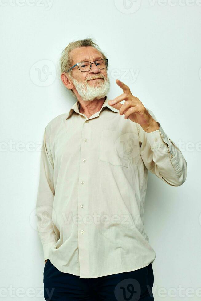 Portrait elderly man wears glasses in shirts isolated background photo