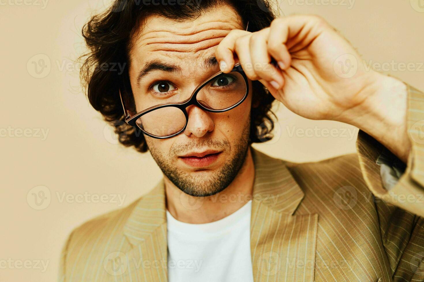 Attractive man spectacled beige suit elegant style Lifestyle unaltered photo