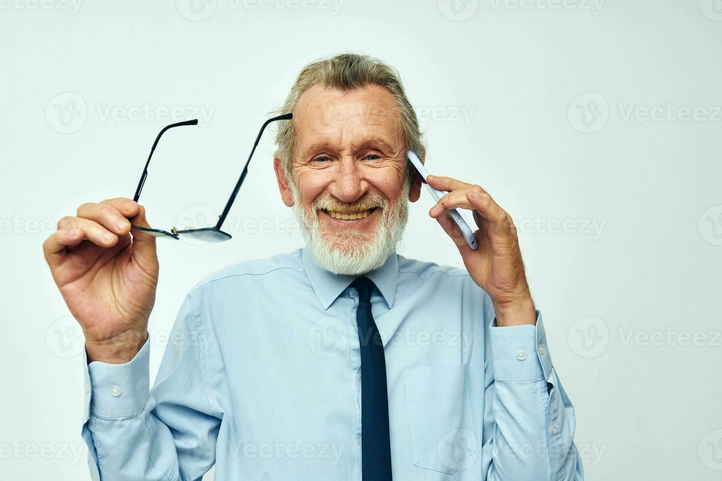 old man telephone communication glasses official light background photo