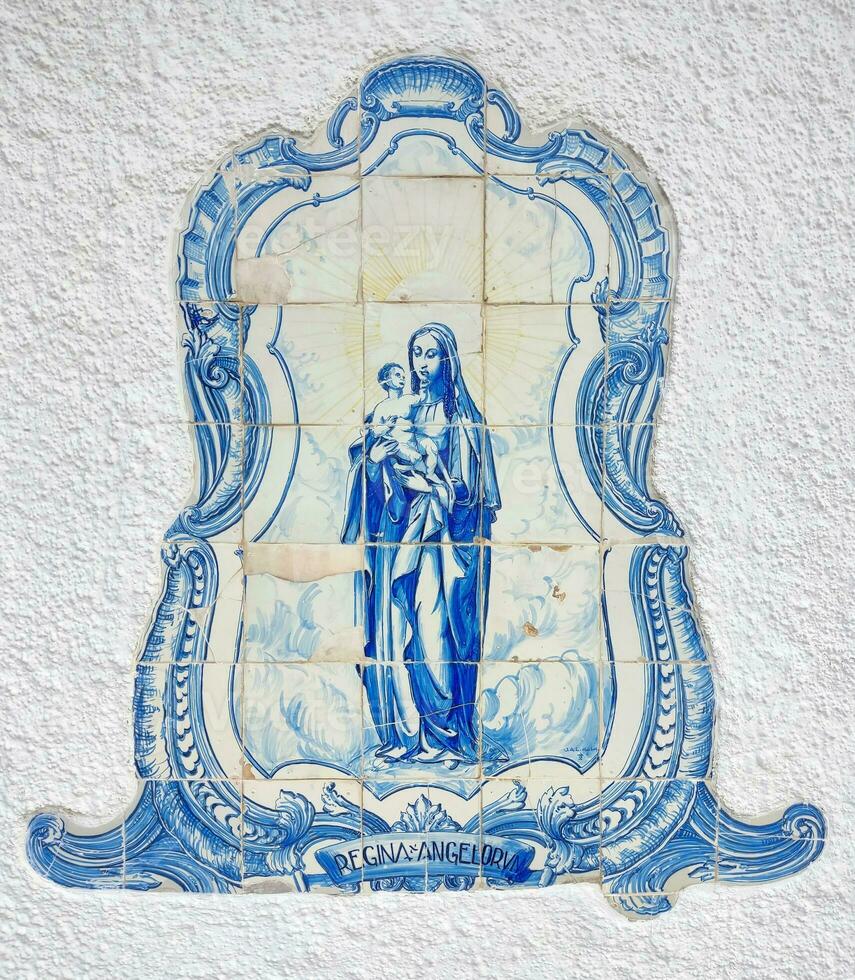 Azulejo tile in Porto, Portugal. Traditional portuguese ceramic decoration blue color. Historic building wall facade. photo