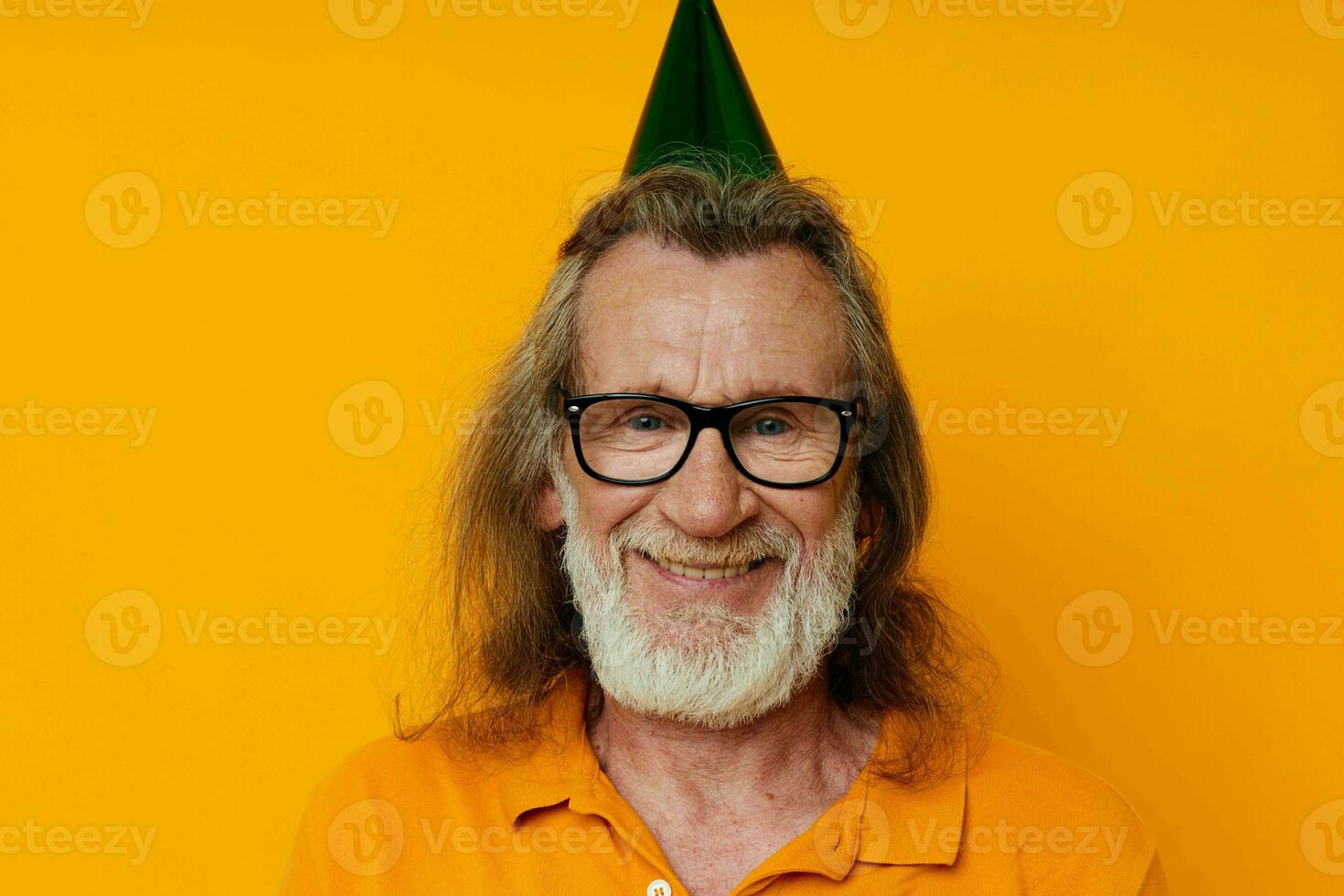 Photo of retired old man in a yellow t-shirt with a cap on his head fun cropped view