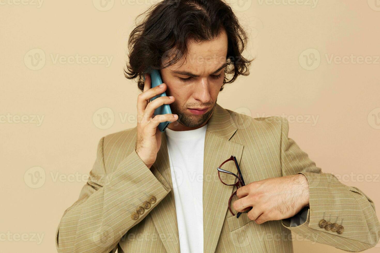 Attractive man talking on the phone technologies isolated background photo