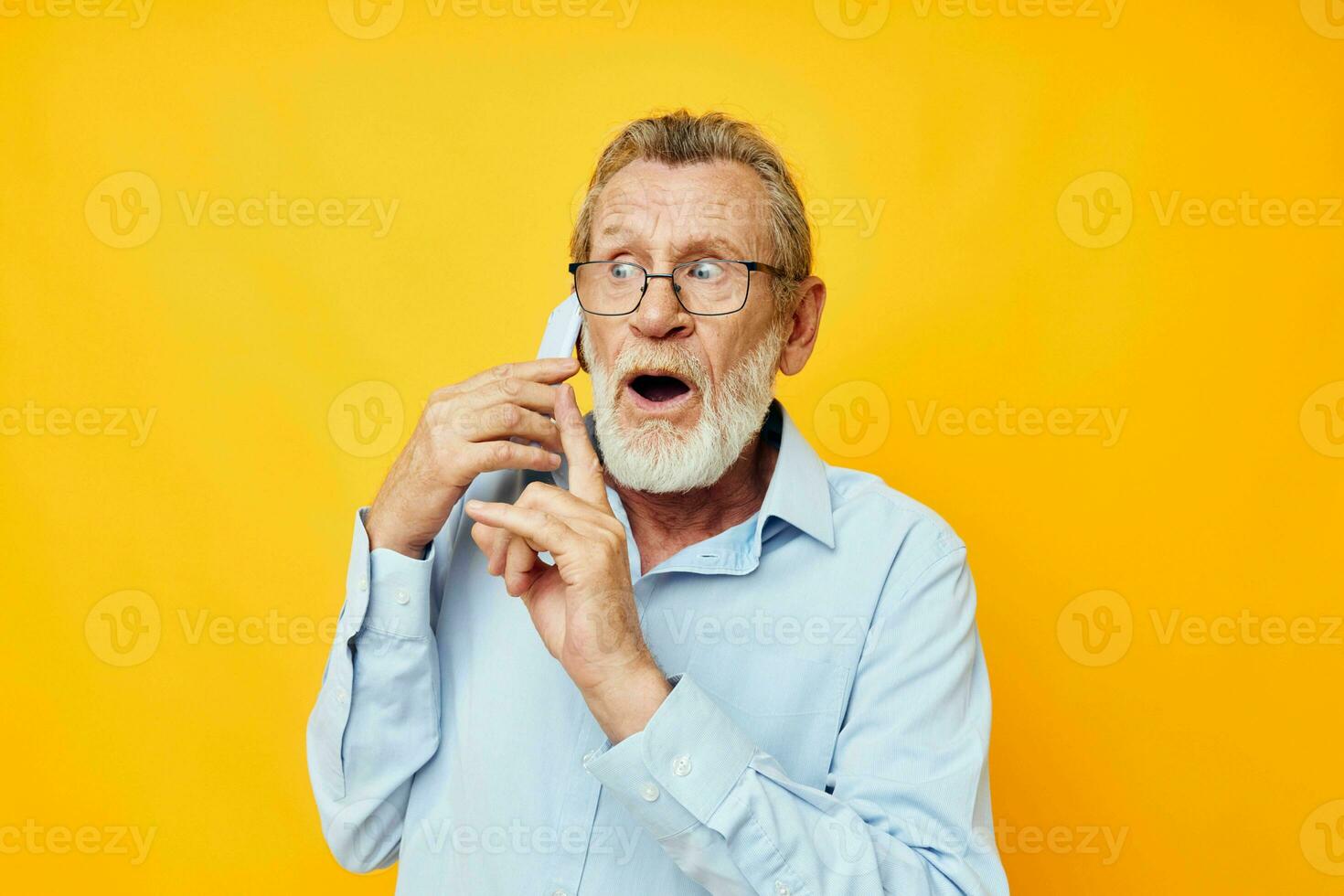 old man talking on the phone posing close-up unaltered photo