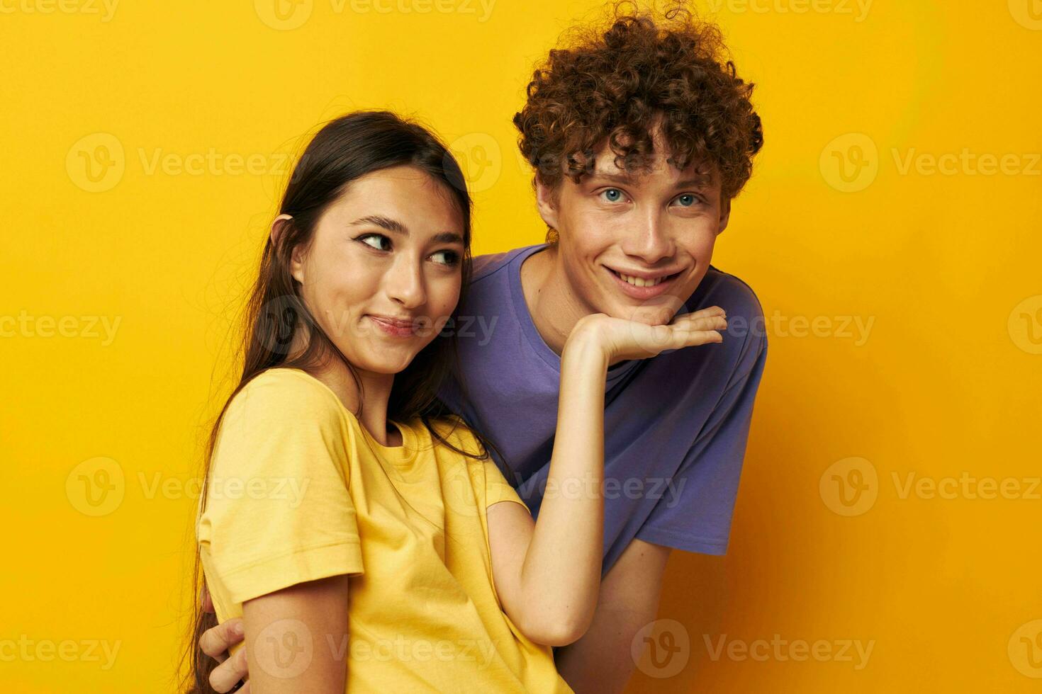 teenagers Friendship posing fun studio yellow background unaltered photo