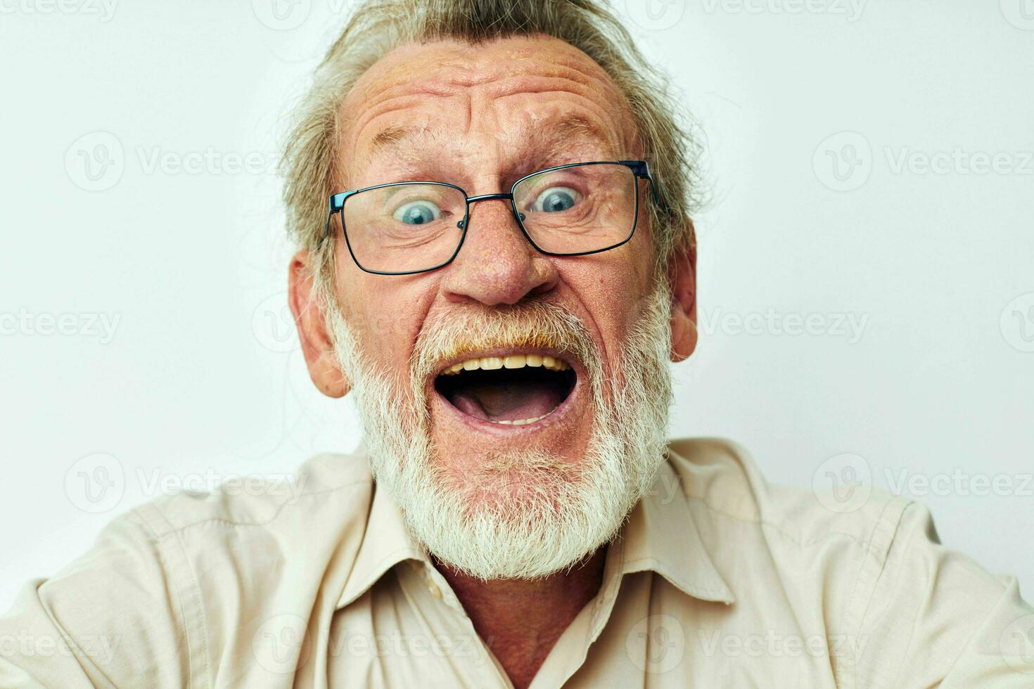 Photo of retired old man with a gray beard in a shirt and glasses unaltered