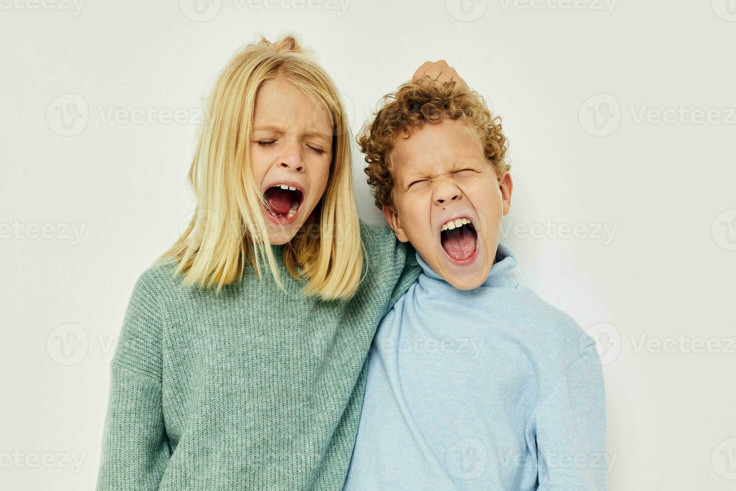 Little boy and girl gesticulate with their hands together childhood unaltered photo