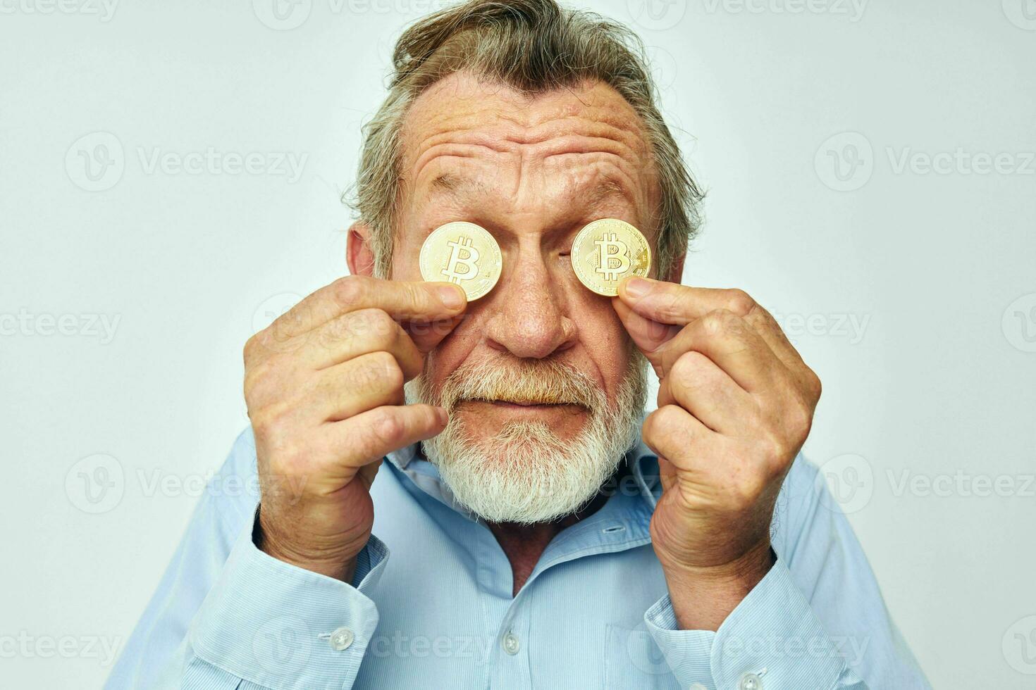 Portrait of happy senior man cryptocurrency bitcoin face close up investment cropped view photo