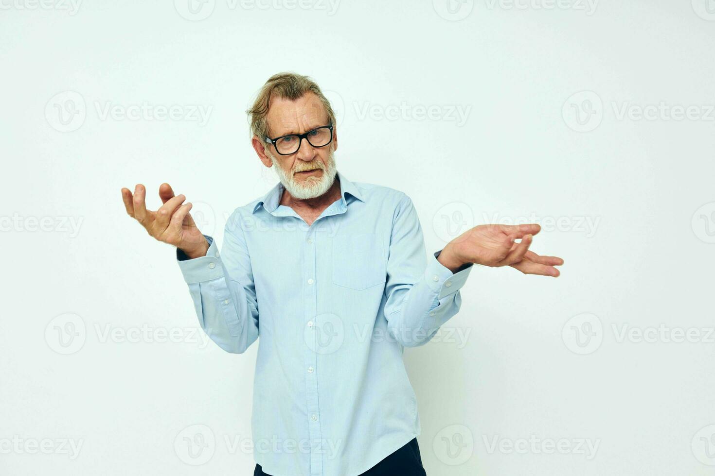 Portrait of happy senior man in shirt and glasses posing emotions isolated background photo