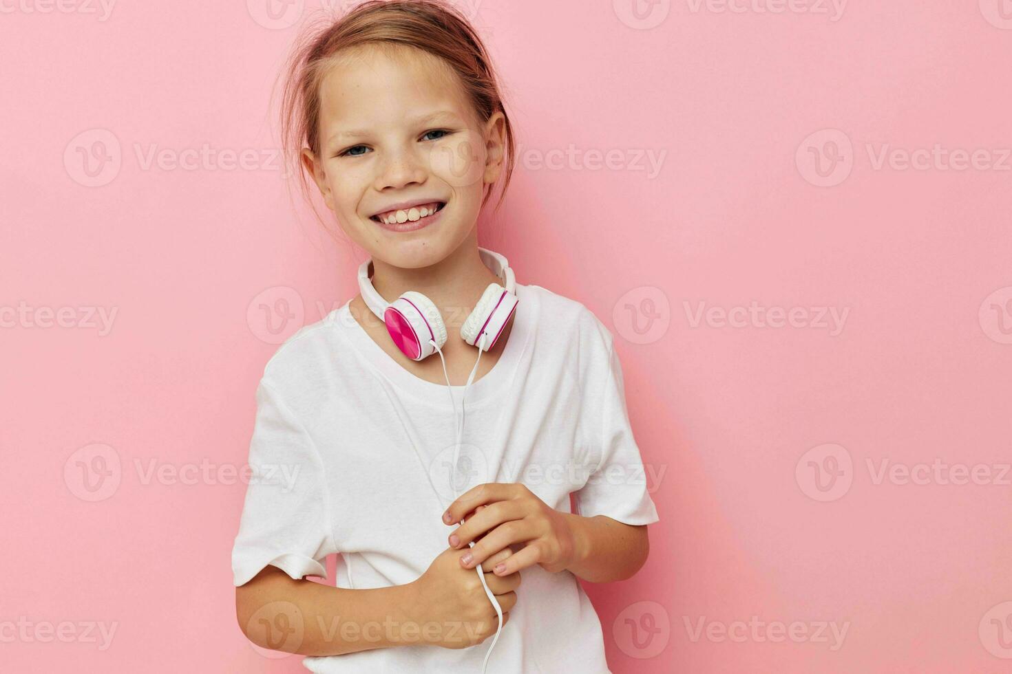 Portrait of happy smiling child girl smile posing headphones isolated background photo