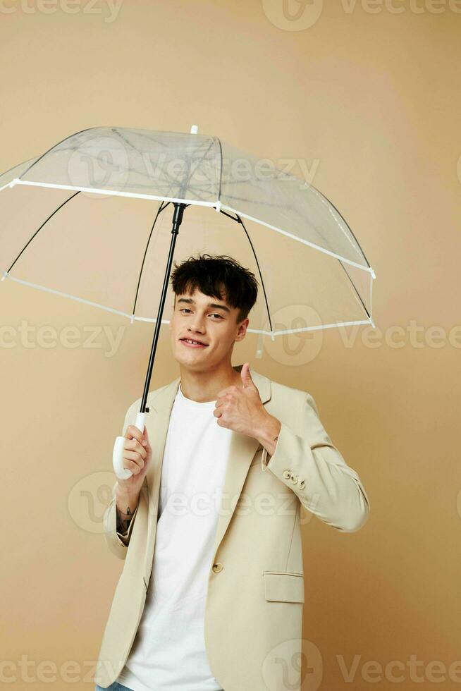 guy in a jacket with an open umbrella rain protection photo