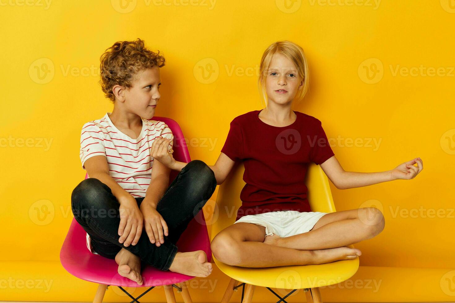 Portrait of cute children smiling and posing in casual clothes against isolated background photo