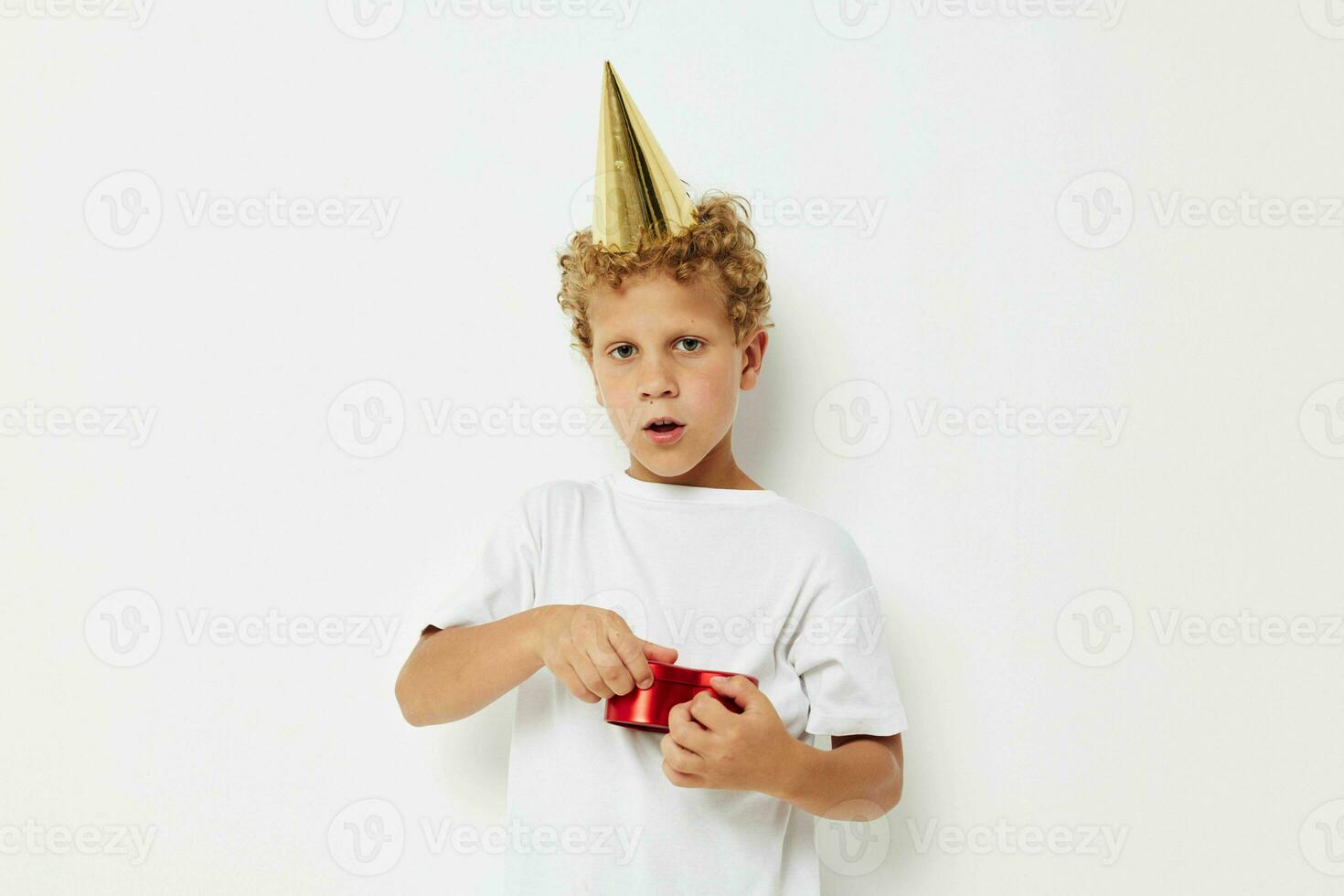 little boy wearing a white t-shirt with a cap on his head birthday gift photo