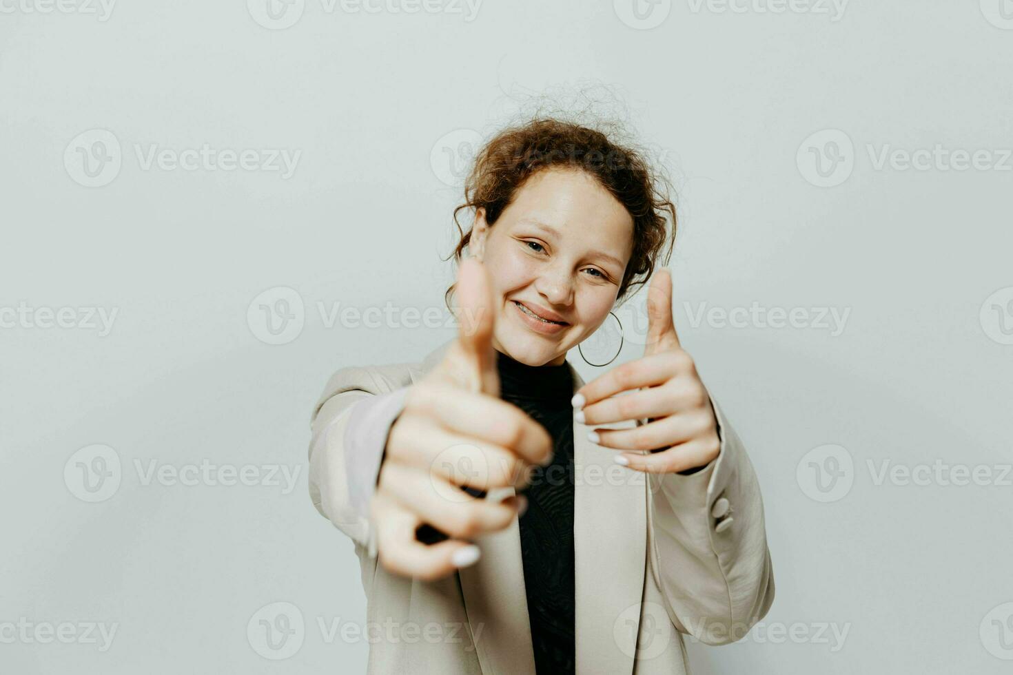 cheerful woman In a light classic suit posing emotions yellow background unaltered photo