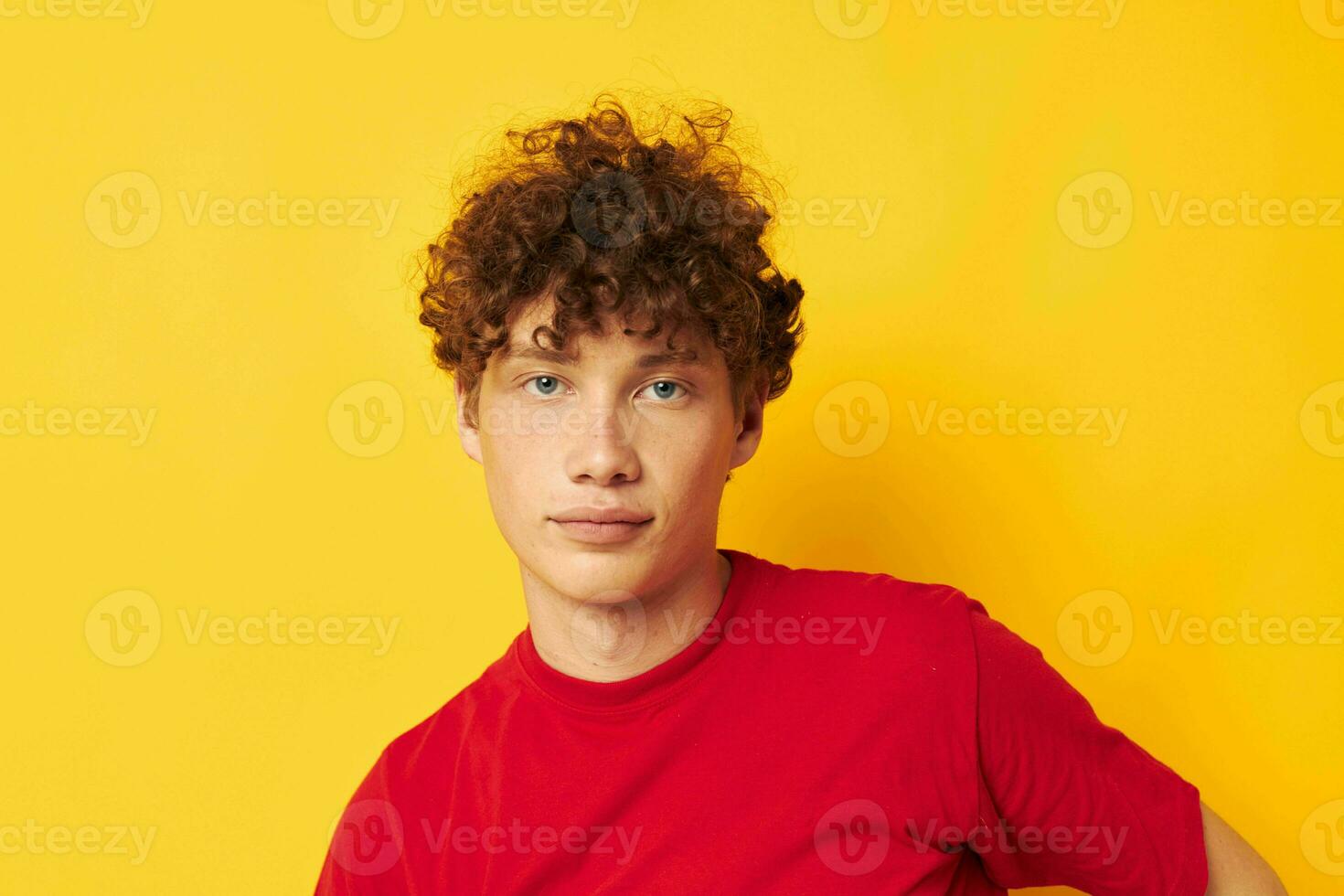 cute red-haired guy red t shirt fun posing casual wear isolated background unaltered photo