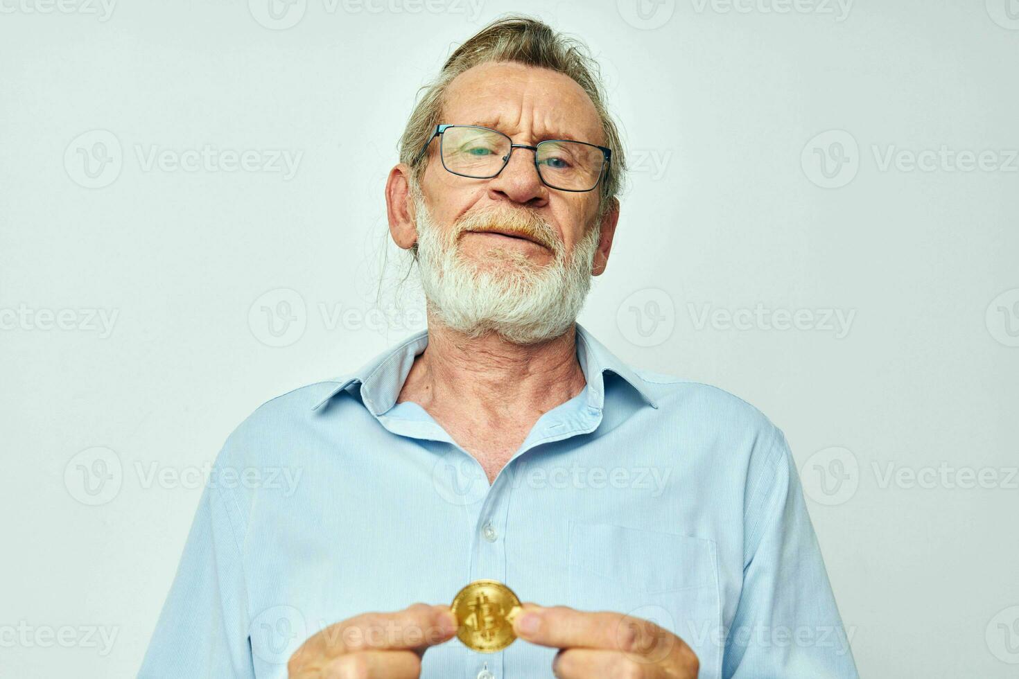 Portrait of happy senior man cryptocurrency bitcoin investment light background photo