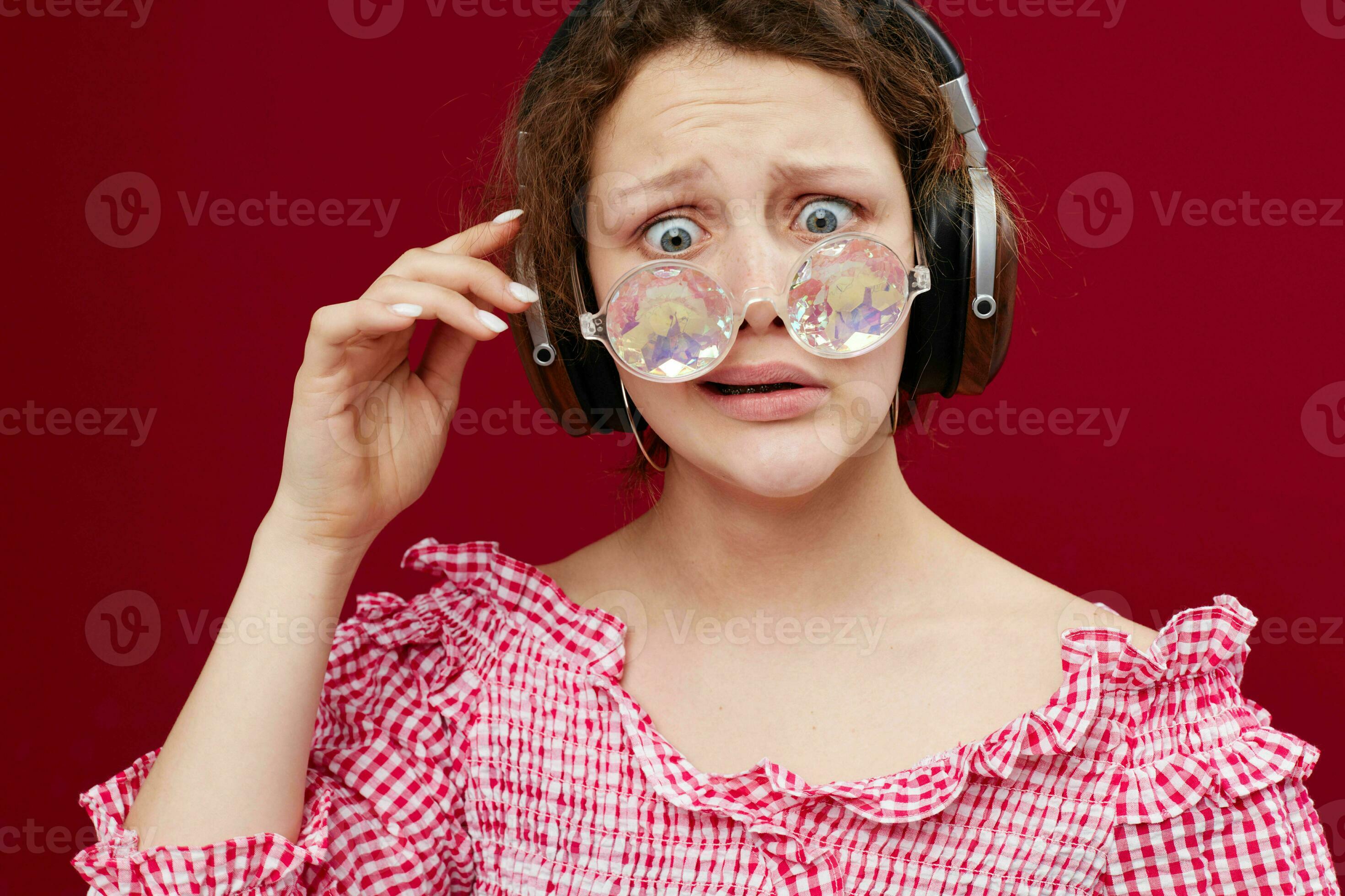 girl wearing headphones glasses in the form of a diamond closeup