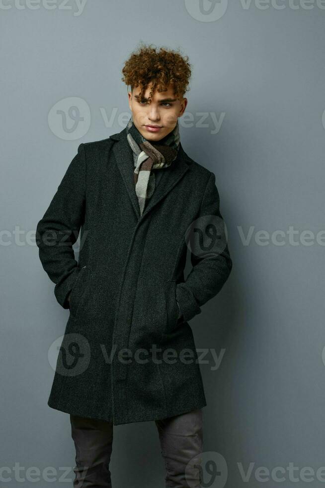 handsome guy Black coat posing fashion Lifestyle unaltered photo