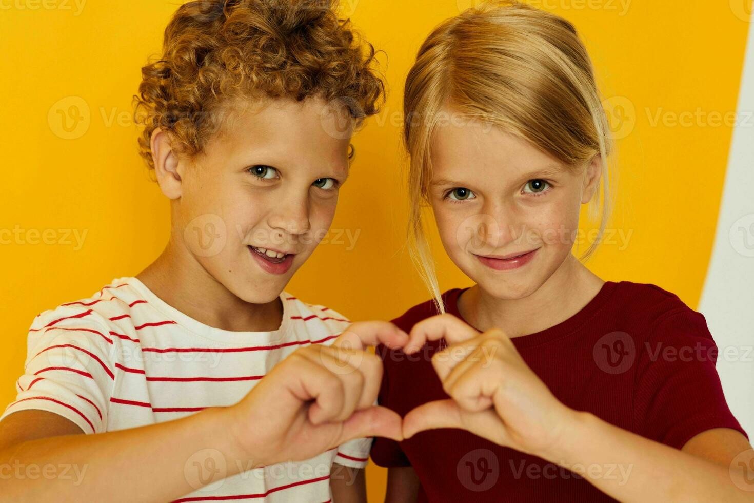 Cute preschool kids cuddling fashion childhood entertainment on colored background photo