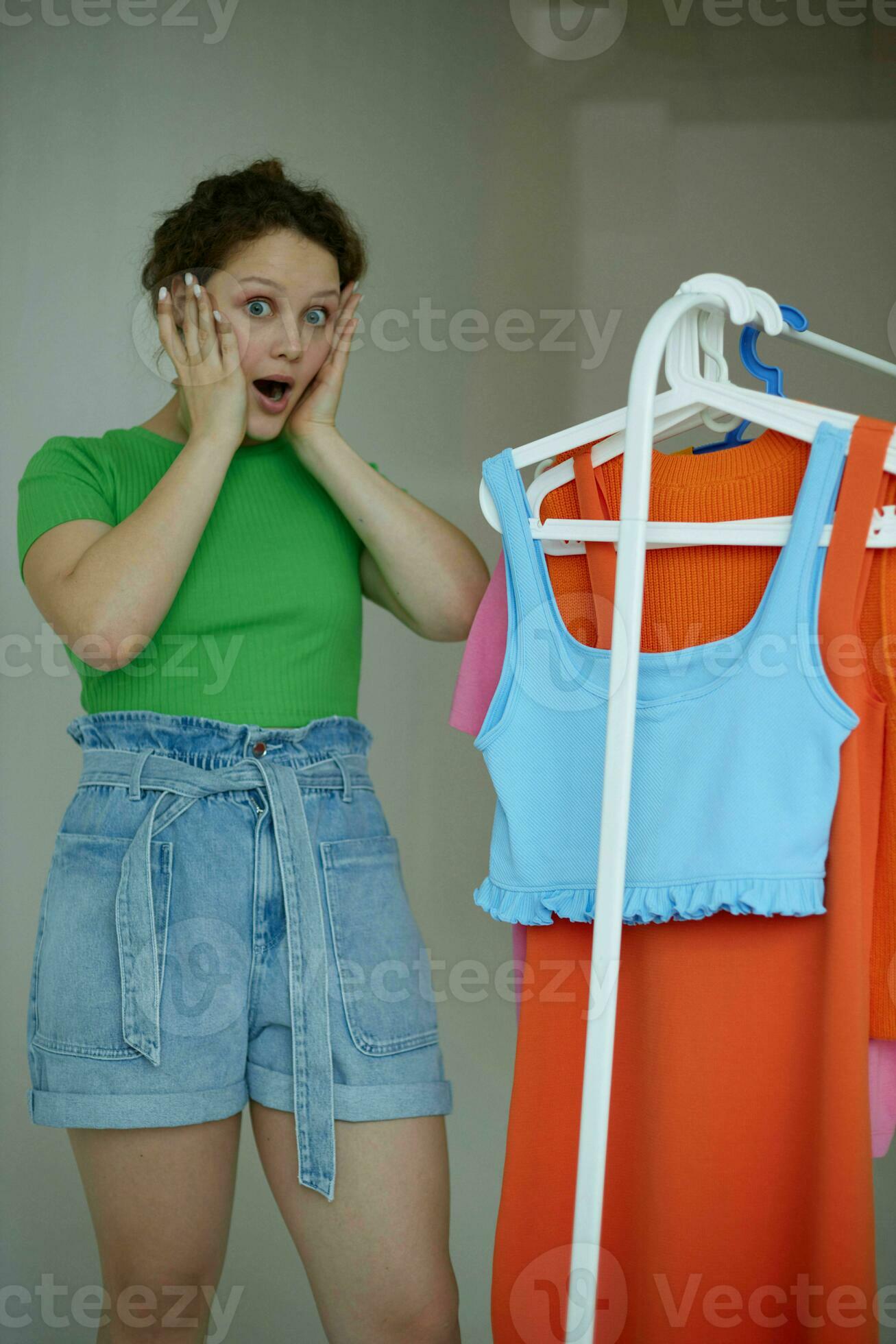 beautiful woman trying on clothes wardrobe Youth style yellow
