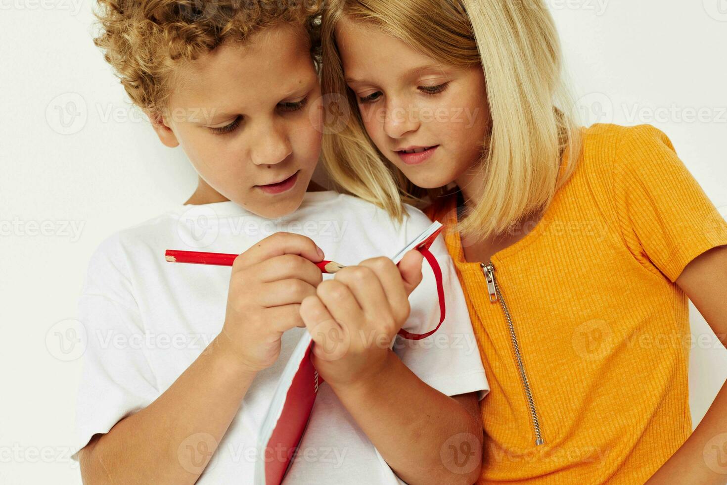 Cute stylish kids stand next to notepad pencil drawing emotions color background unaltered photo