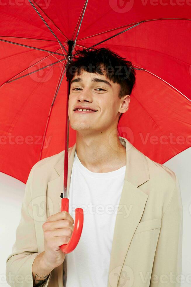 A young man rain protection in hand in hand modern style isolated background unaltered photo