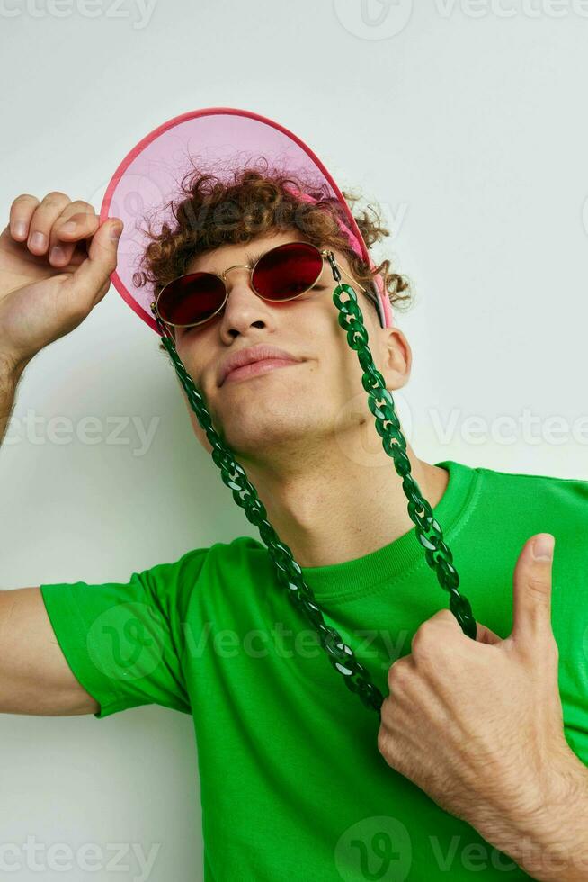 handsome young man stylish glasses cap close-up isolated background photo