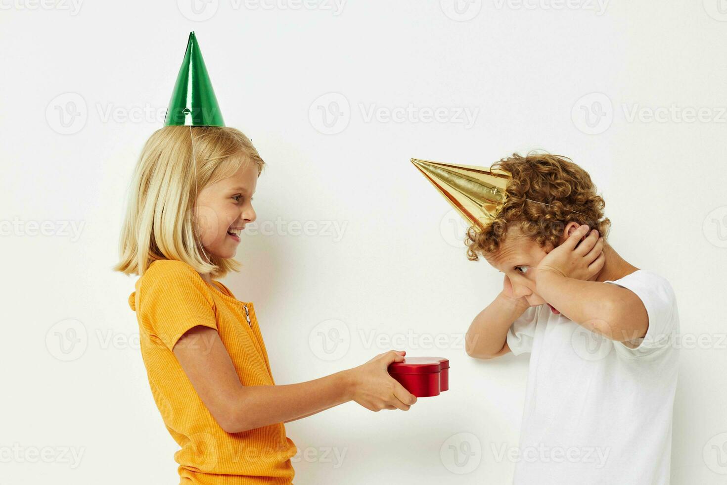 girl giving a gift to a boy birthday surprise photo