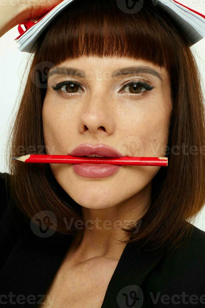 attractive woman short haired red notepad and pencil isolated background photo