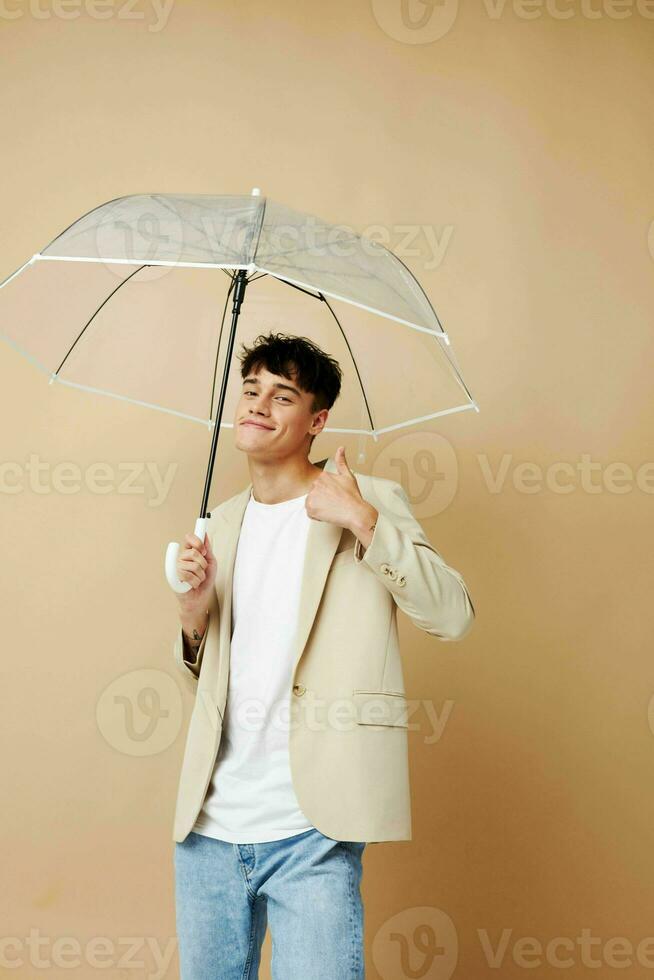 guy in a jacket with an open umbrella rain protection photo