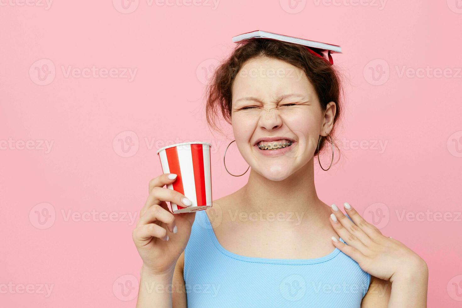 girl with red notepad disposable glass emotions pink background unaltered photo
