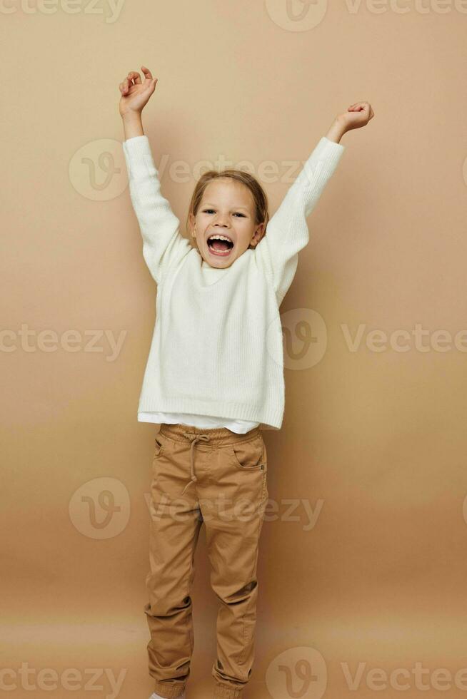 cute girl in white sweater posing hand gestures childhood unaltered photo